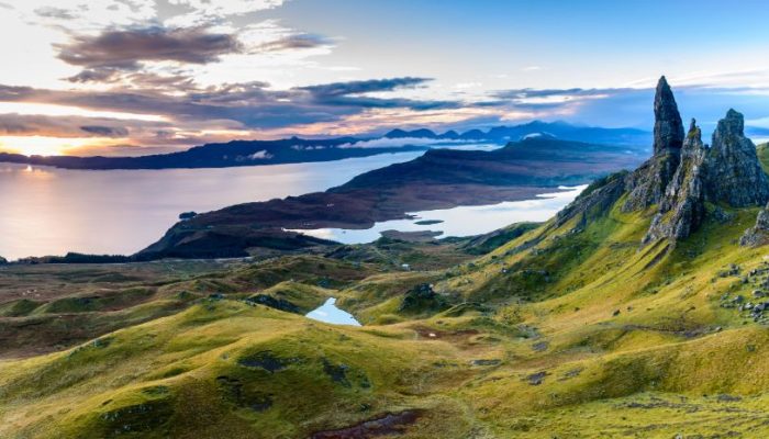 Misty mountains and lochs in the Scottish Highlands.