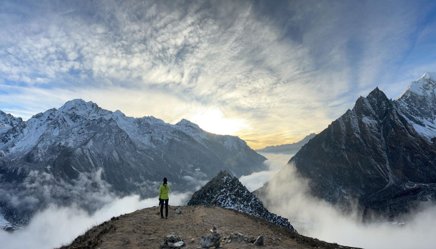 A crystal-clear lake reflecting snow-capped Rocky Mountains.