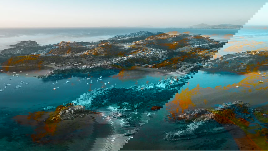 Coastal cliffs and turquoise water in New Zealand.